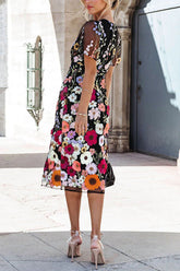 Vestido midi con abertura y apliques florales